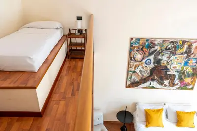 Letto o letti in una camera di Maiorani Family Apartment nel Centro di Napoli by Wonderful Italy