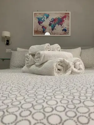 Letto o letti in una camera di Terrazza Aragon Room and SPA