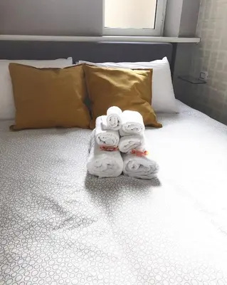 Letto o letti in una camera di Terrazza Aragon Room and SPA