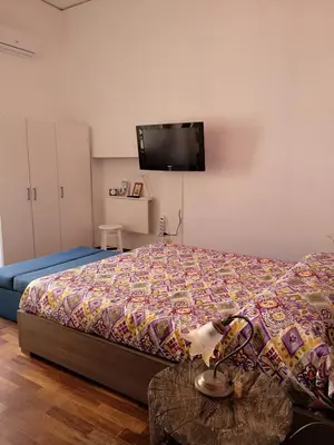 Letto o letti in una camera di B&B Smiling Naples