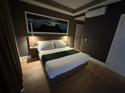 Letto o letti in una camera di 7th Floor Suite