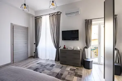 Letto o letti in una camera di Palazzo Mormando - Modern Apartment