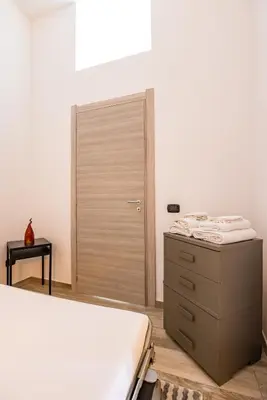 Letto o letti in una camera di Palazzo Mormando - Modern Apartment