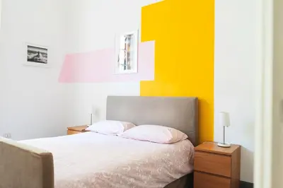 Letto o letti in una camera di Casa Conforti luminosa in centro