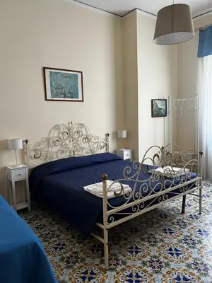 Letto o letti in una camera di Maman Suite, city center near Molo Beverello