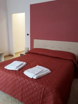 Letto o letti in una camera di Le Sirene