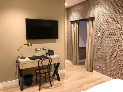 TV o dispositivi per l'intrattenimento presso Caruso Place Luxury Rooms & Suites