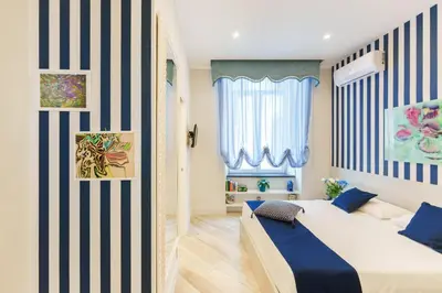 Letto o letti in una camera di It's Room Naples