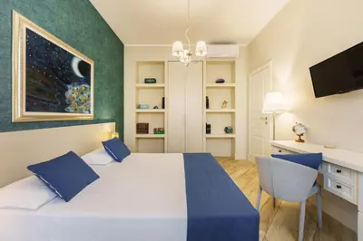 Letto o letti in una camera di It's Room Naples