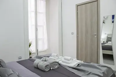 Letto o letti in una camera di Amare Napoli