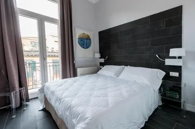 Letto o letti in una camera di Residenza Trinità Maggiore