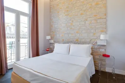 Letto o letti in una camera di Residenza Trinità Maggiore