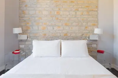 Letto o letti in una camera di Residenza Trinità Maggiore