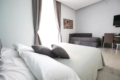 Letto o letti in una camera di Toledo 16 Luxury Suites