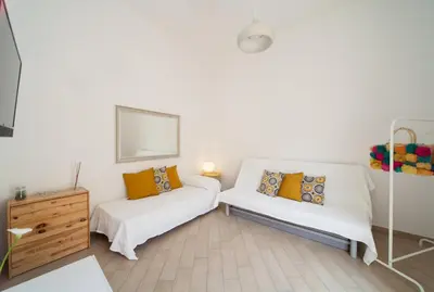 Letto o letti in una camera di Napoli Centro Suite - Duomo Apartment