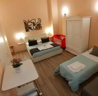 Letto o letti in una camera di Da Polly a Piazza Amedeo