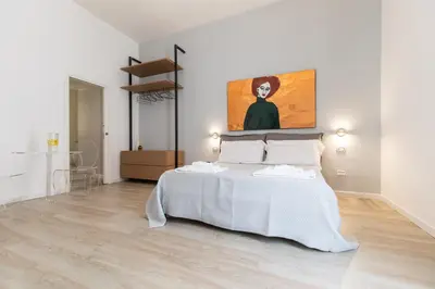 Letto o letti in una camera di Palazzo Della Porta