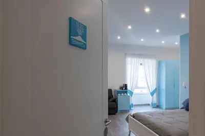 Letto o letti in una camera di Suite Napoletana