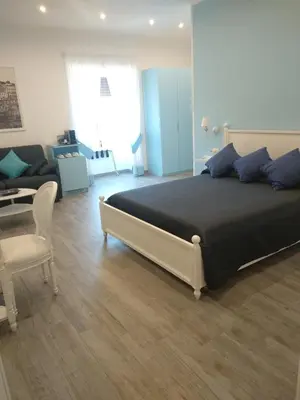Letto o letti in una camera di Suite Napoletana
