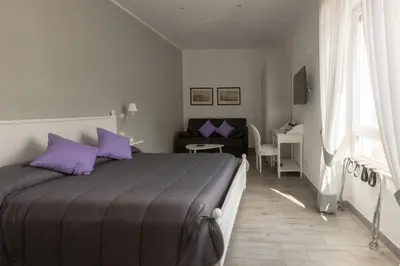 Letto o letti in una camera di Suite Napoletana