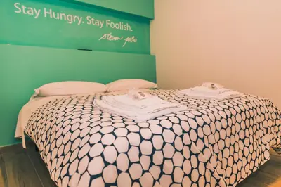 Letto o letti in una camera di St. Teresa Museum Suites