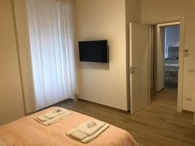 Letto o letti in una camera di St. Teresa Museum Suites