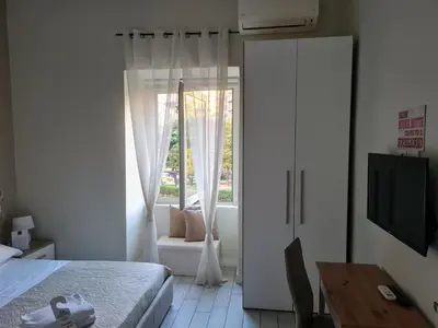 Letto o letti in una camera di ESPOSITO PLAZA- ROOMS & SUITE