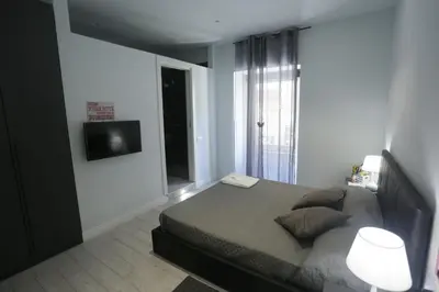 Letto o letti in una camera di ESPOSITO PLAZA- ROOMS & SUITE