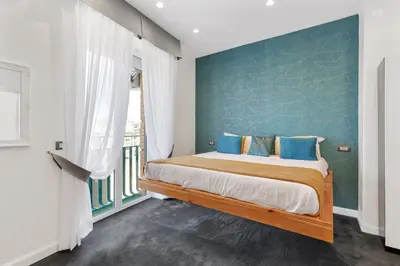 Letto o letti in una camera di Mayfair Lifestyle Suites by Babylon Stay