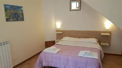 Letto o letti in una camera di Bed and Breakfast I Vicoletti Di Napoli