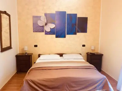 Letto o letti in una camera di B&B Alloggio Maria