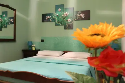 Letto o letti in una camera di B&B Alloggio Maria