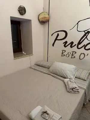 Letto o letti in una camera di B&B O' Core e Napule
