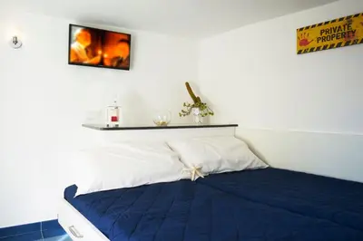 Letto o letti in una camera di Neapolitan House
