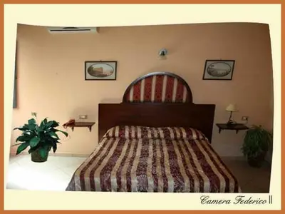 Letto o letti in una camera di B&B La Storia Di Napoli