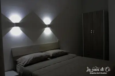 Letto o letti in una camera di B&B La casa di Cò
