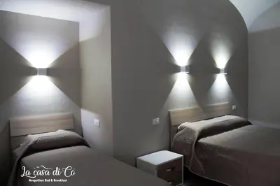 Letto o letti in una camera di B&B La casa di Cò