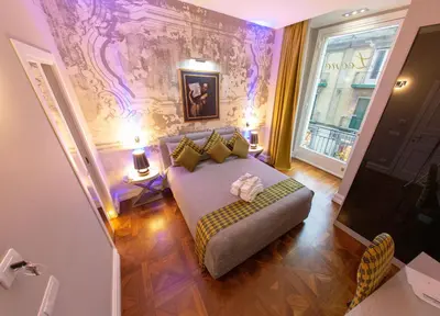 Letto o letti in una camera di Leone Camere D'autore - CHIAIA
