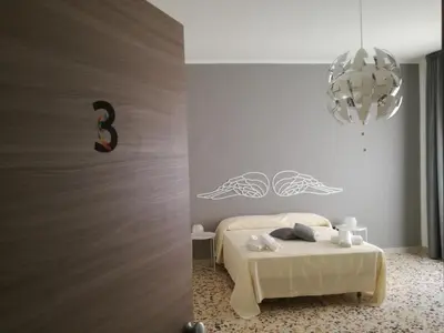 Letto o letti in una camera di Spira Mirabilis Napoli