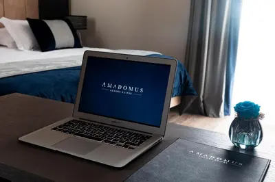 Letto o letti in una camera di Amadomus Luxury Suites