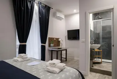 Letto o letti in una camera di Sant'Alfonso Bed and Breakfast Napoli