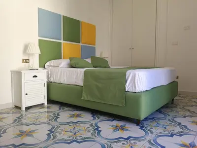Letto o letti in una camera di SuiteNapoliSantaLucia