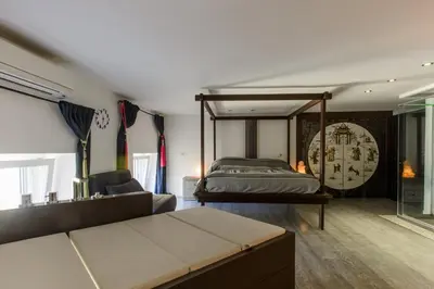 Letto o letti in una camera di luxury suite San Carlo