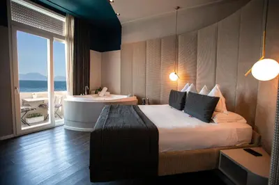 Letto o letti in una camera di Relais sul Mare Boutique Hotel