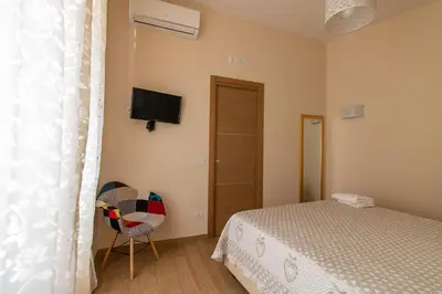 Letto o letti in una camera di Domus Campanile