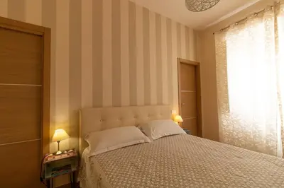 Letto o letti in una camera di Domus Campanile