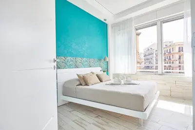 Letto o letti in una camera di Luxury Experience | WelcHome Napoli