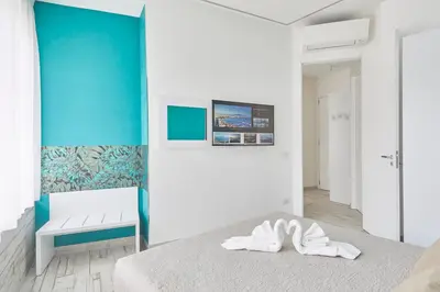 Letto o letti in una camera di Luxury Experience | WelcHome Napoli