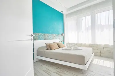 Letto o letti in una camera di Luxury Experience | WelcHome Napoli