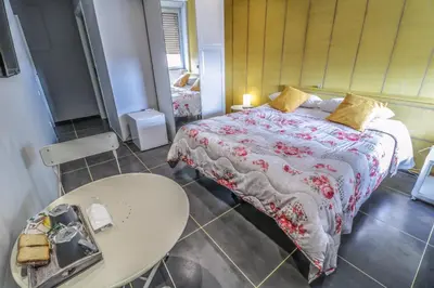 Letto o letti in una camera di Il Grattacielo b&b